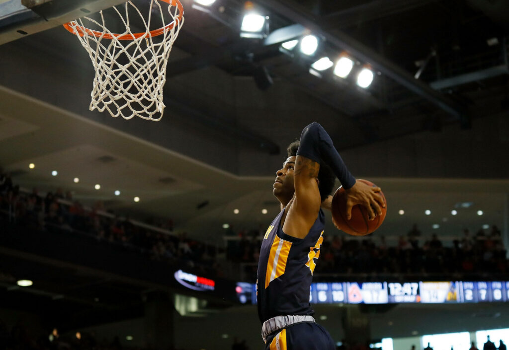 Ja Morant's Epic Two-Hand Tomahawk Dunk - Dynamic Basketball Wallpaper