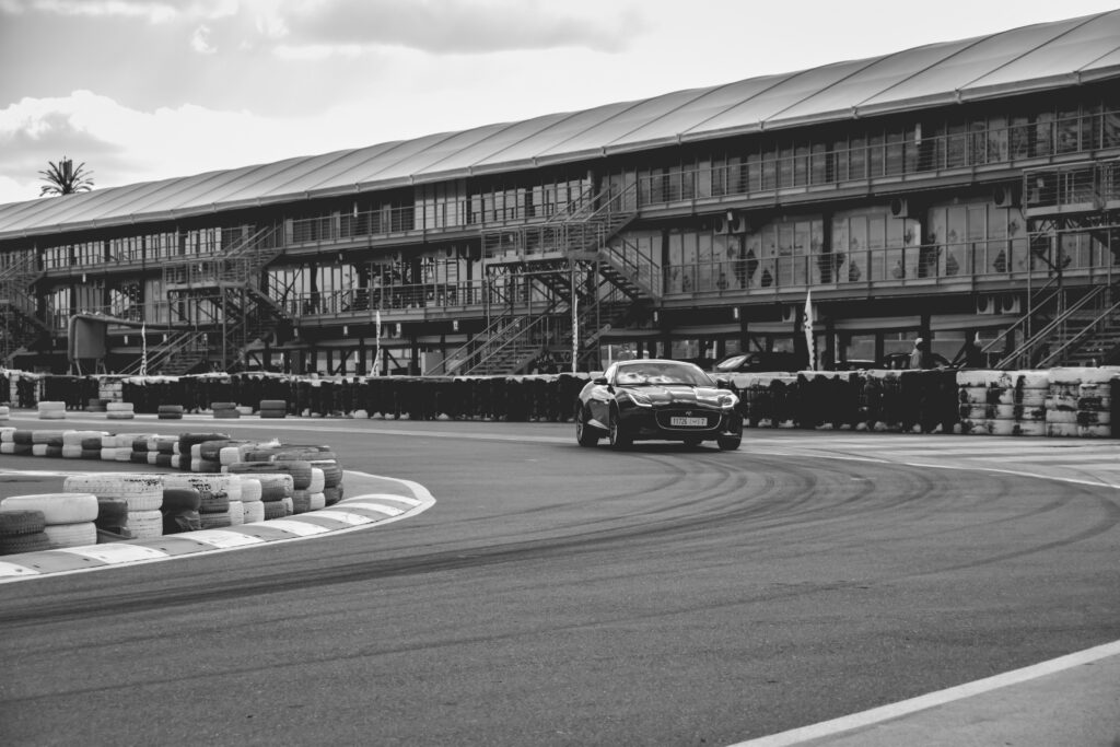 Jaguar Sports Car Racing Wallpaper: Dynamic Black and White Design