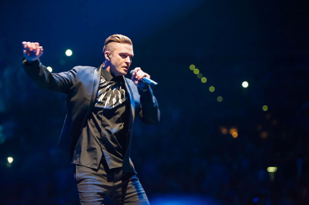 Dynamic Justin Timberlake Wallpaper: Passionate Live Performance Background