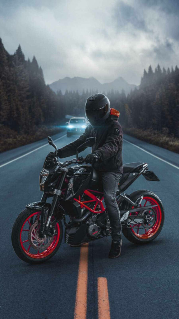 Thrilling Biker iPhone Wallpaper: KTM in Misty Forest Adventure