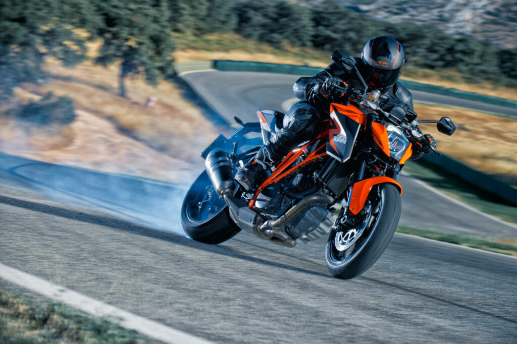 Thrilling KTM Duke 200 Wallpaper: Tire Smoke & Speed Adventure