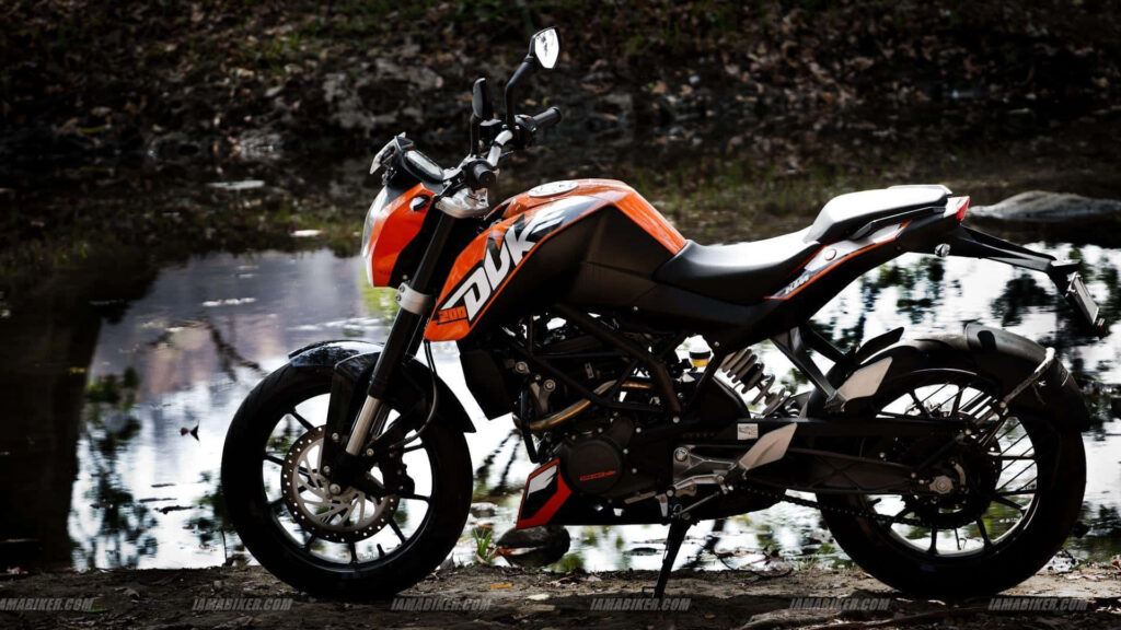 Sporty KTM Duke Wallpaper: Thrilling Nature & Water Backdrop