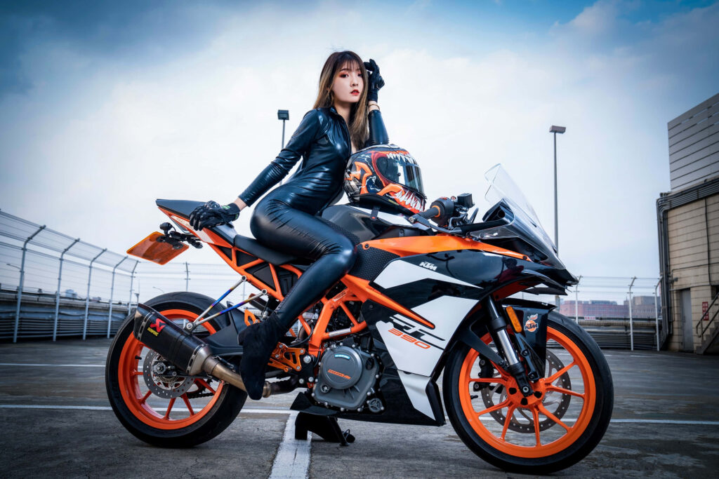 Vibrant KTM Motorcycle Wallpaper: Bold Style Meets Urban Action