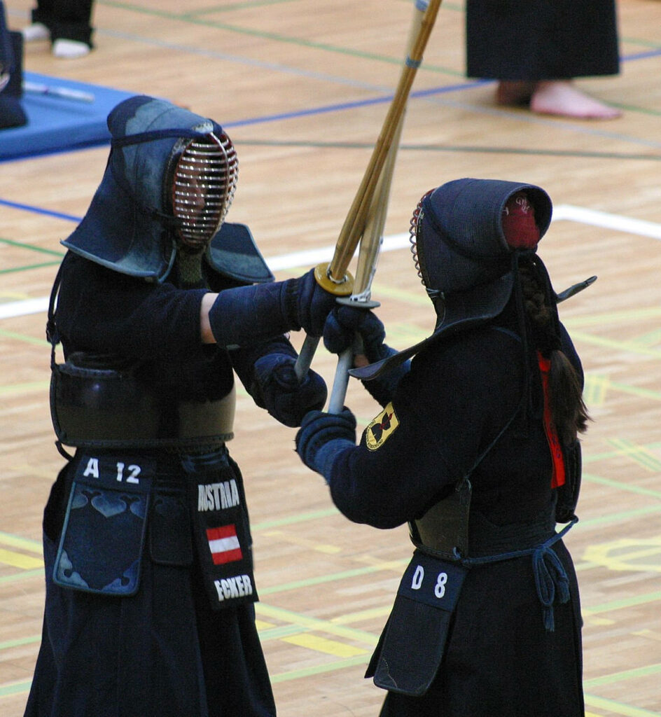 Dynamic Kendo Championship Wallpaper: Intense Duel in Action