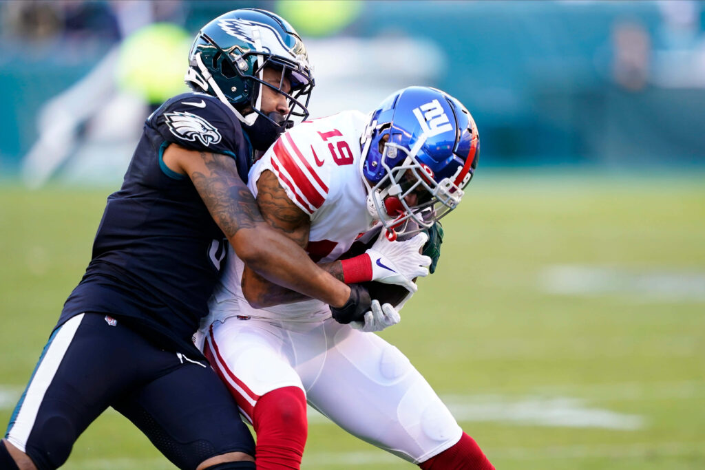 Dynamic Kenny Golladay Football Tackle Wallpaper Background