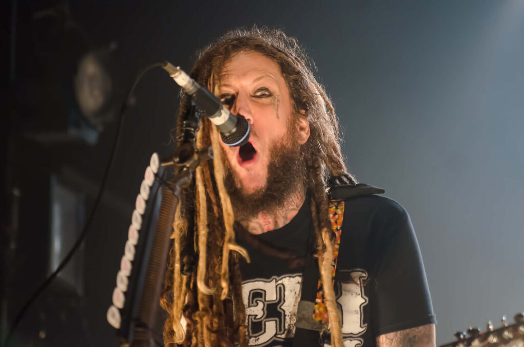 Dynamic Korn Live Wallpaper: Intense Stage Performance Background