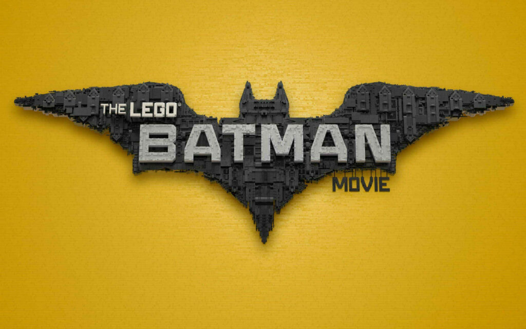 The Blocky Triumph of LEGO Batman Movie: A Golden Bat's LEGO Logo on Grand Display Wallpaper