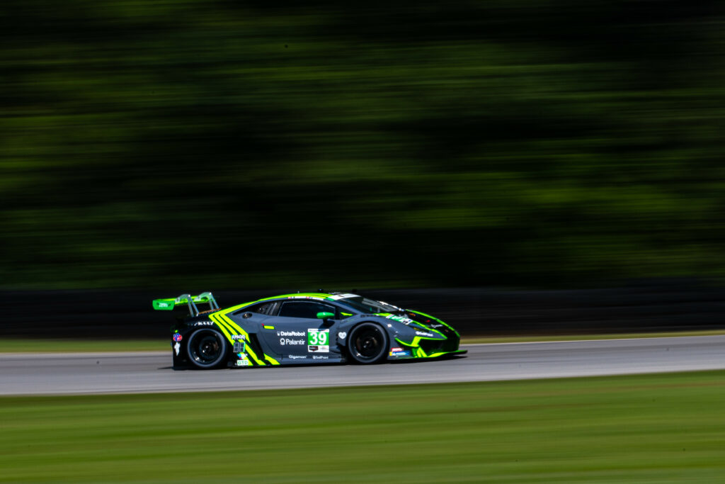 Racing Lamborghini Huracan: Sleek Green Design & Dynamic Background Wallpaper
