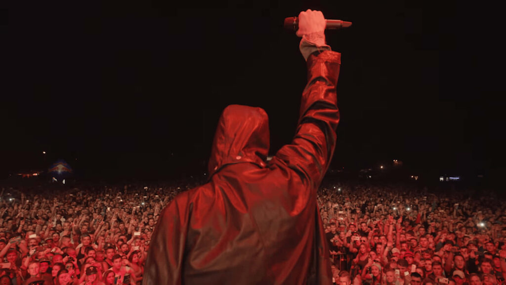 MGK Live Performance Wallpaper: Energized Crowd & Red Lighting