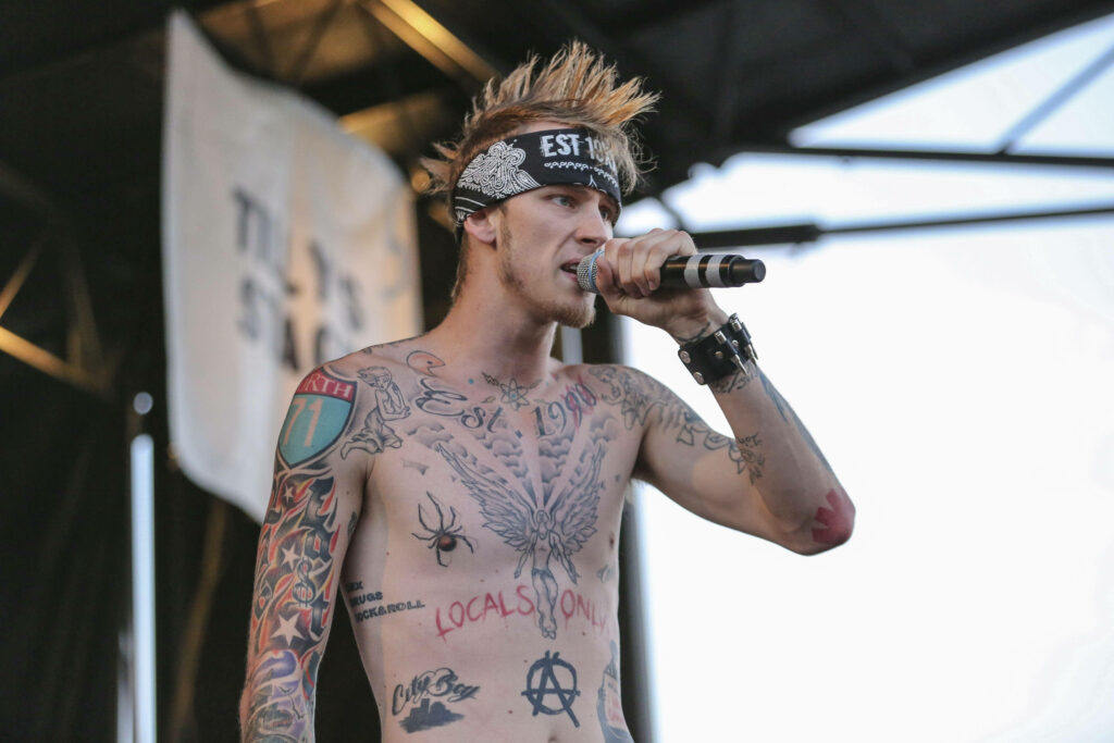 Vibrant Machine Gun Kelly Live Concert Wallpaper - Energetic Stage Art