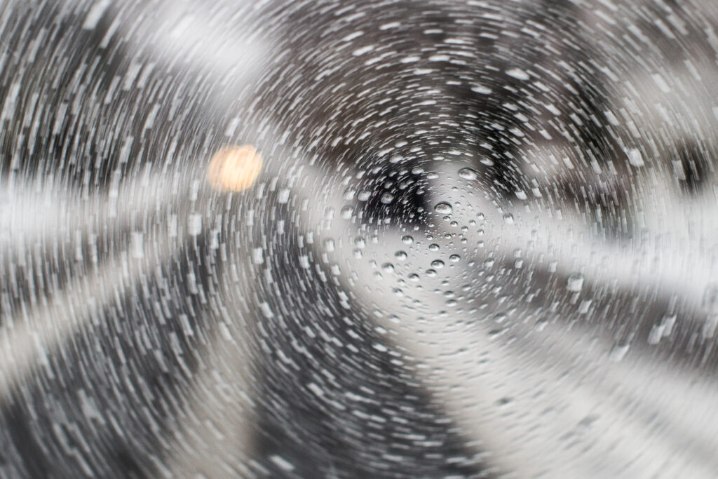 Dynamic Macro Raindrops on Glass: Abstract Wallpaper Background