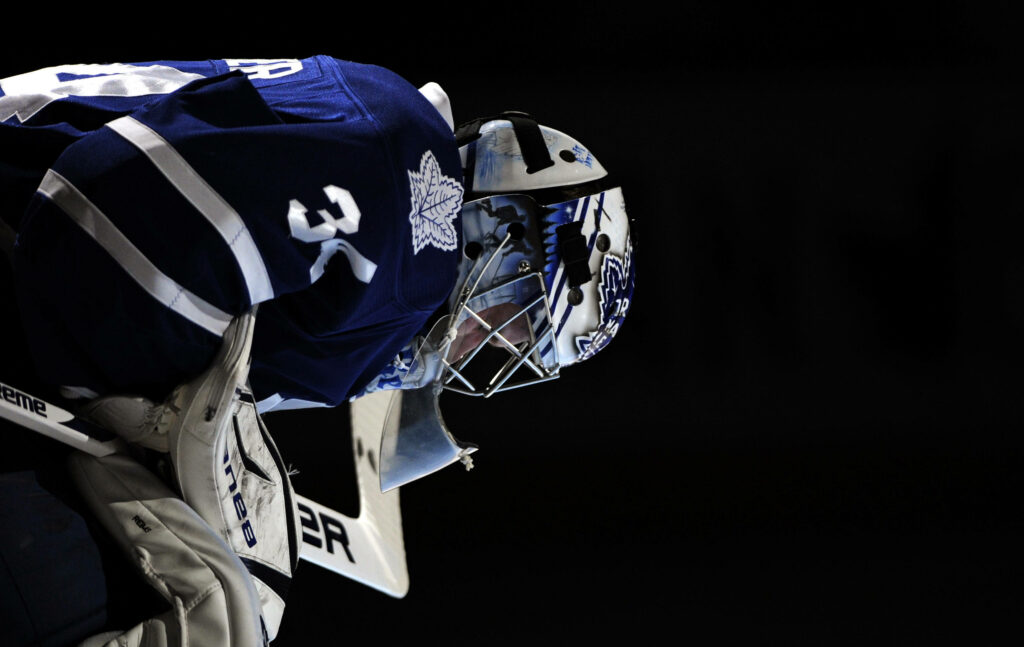 Toronto Maple Leafs Player in Action - Dynamic Hockey Wallpaper