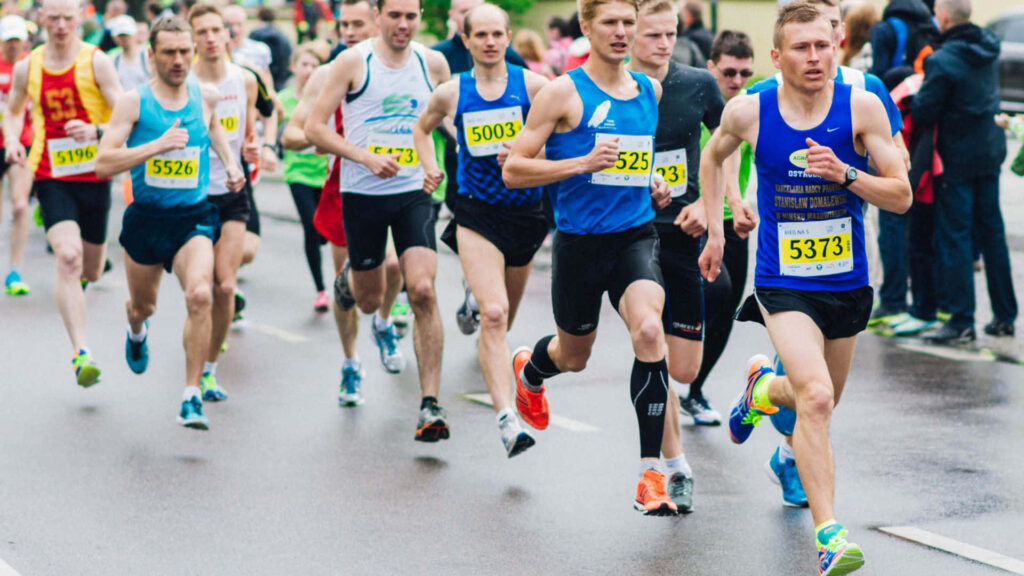 Dynamic Marathon Runners Wallpaper: Determination & Endurance Background