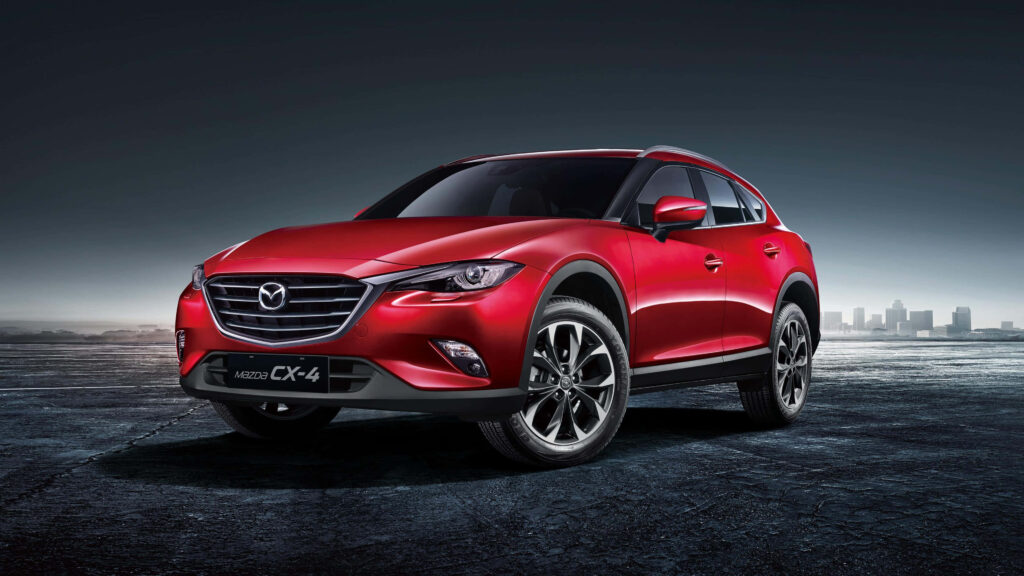 Dynamic Mazda CX-5 Wallpaper: Sleek Red Design in Urban Motion