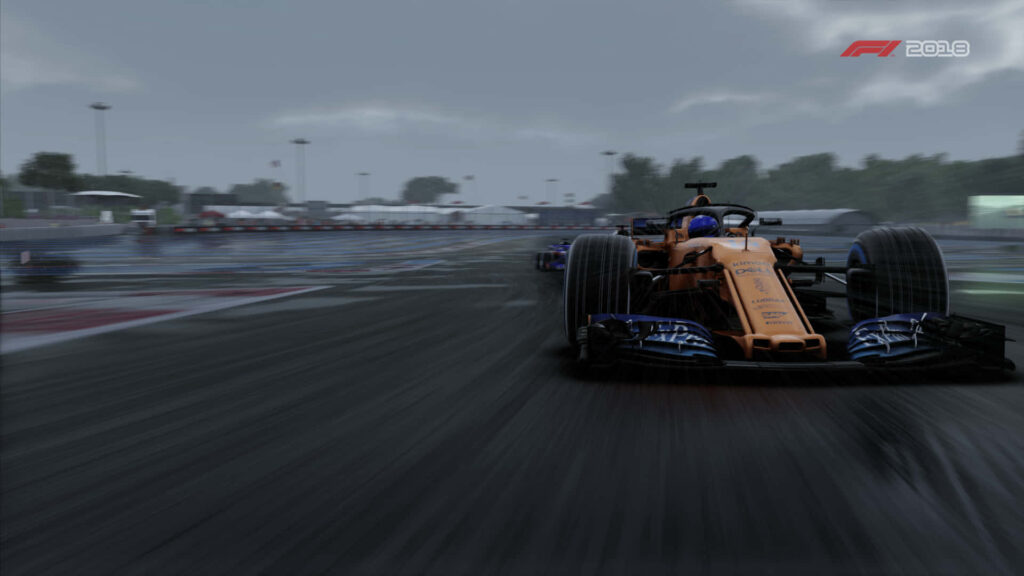 McLaren MCL33 F1 Car Wallpaper: Dynamic Rainy Racing Scene