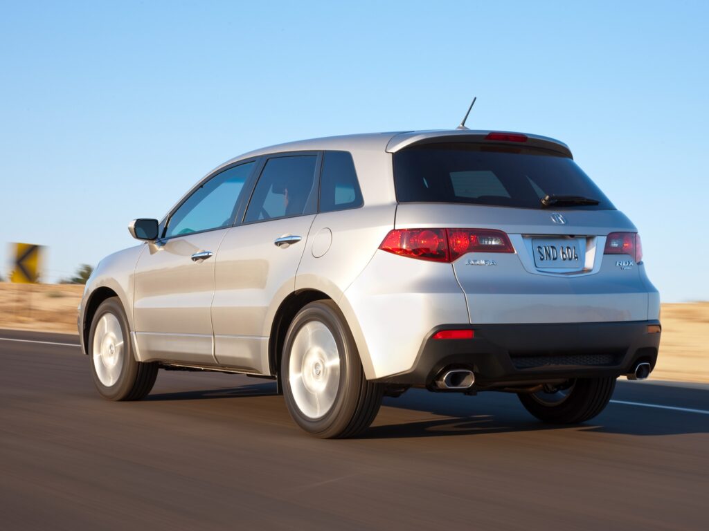 Stylish Metallic Silver Acura RDX Speeding on Open Road - Wallpaper