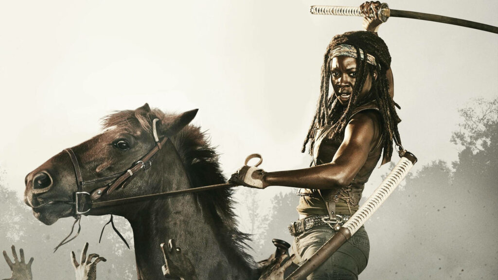 Fearless Michonne Wallpaper: Horse Riding with Sword in Dramatic Scene
