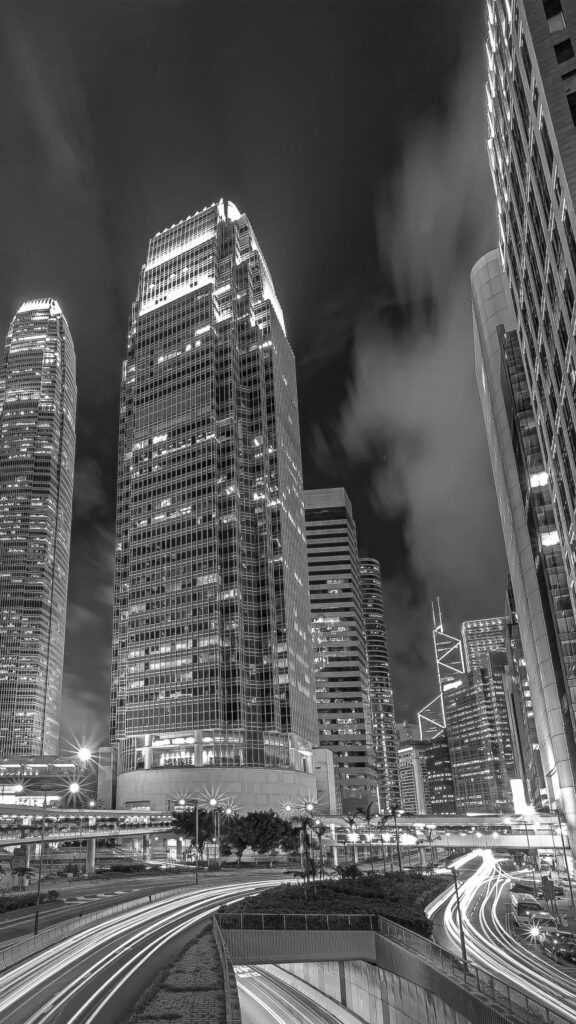 Dynamic Cityscape Wallpaper: Nighttime Skyscrapers & Light Trails