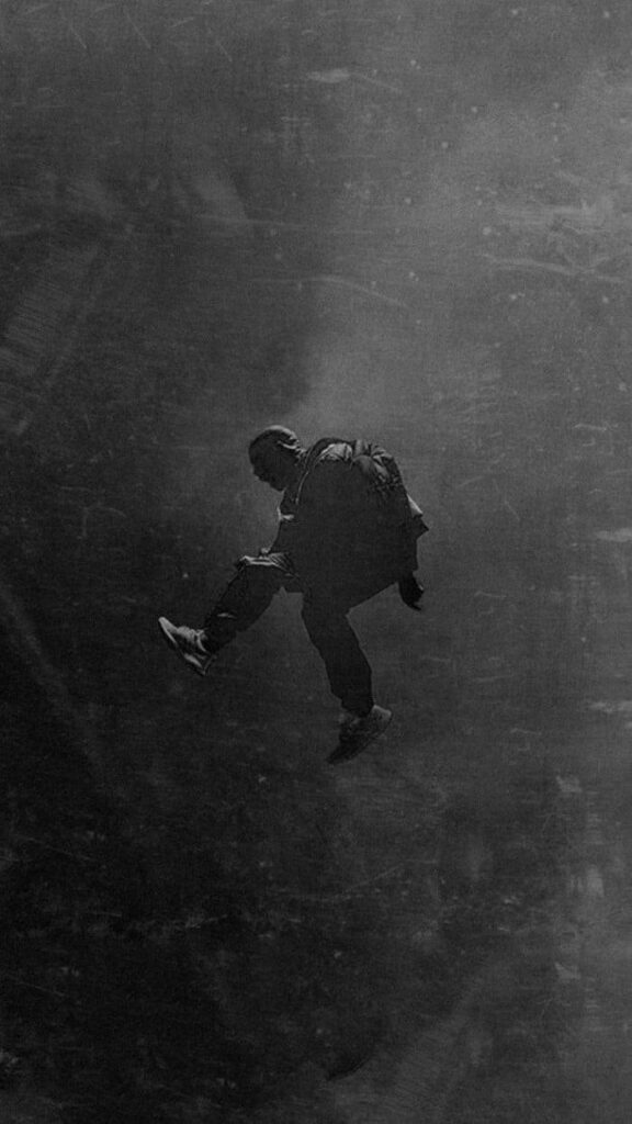 Dynamic Monochrome Man Mid-Jump Wallpaper for Android Background