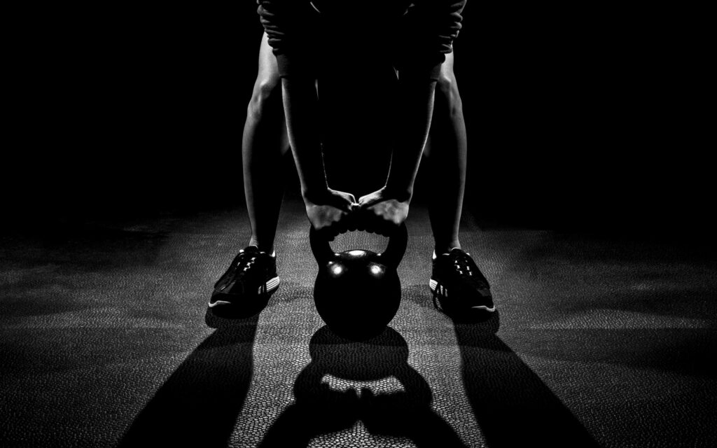 Monochrome Kettlebell Strength: Dynamic Fitness Wallpaper