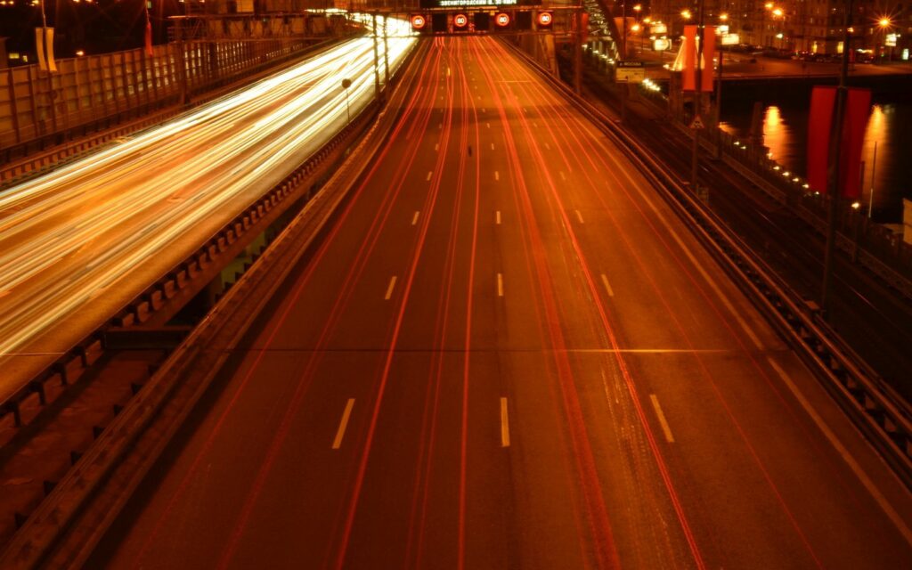 Vibrant Moscow Nighttime Cityscape Wallpaper with Dynamic Light Trails