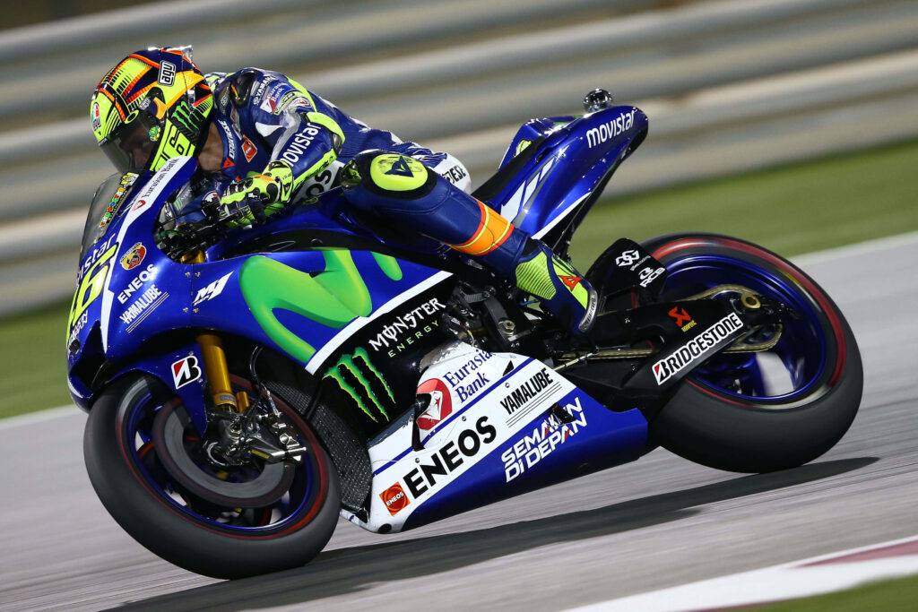 Dynamic MotoGP VR46 Racing Wallpaper - Blue & Yellow Thrill