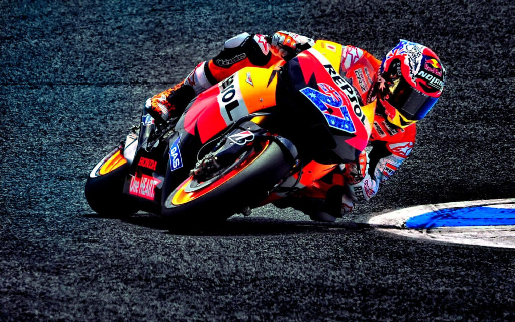 Vibrant Motorcycle Race Wallpaper: High-Speed Precision in Action