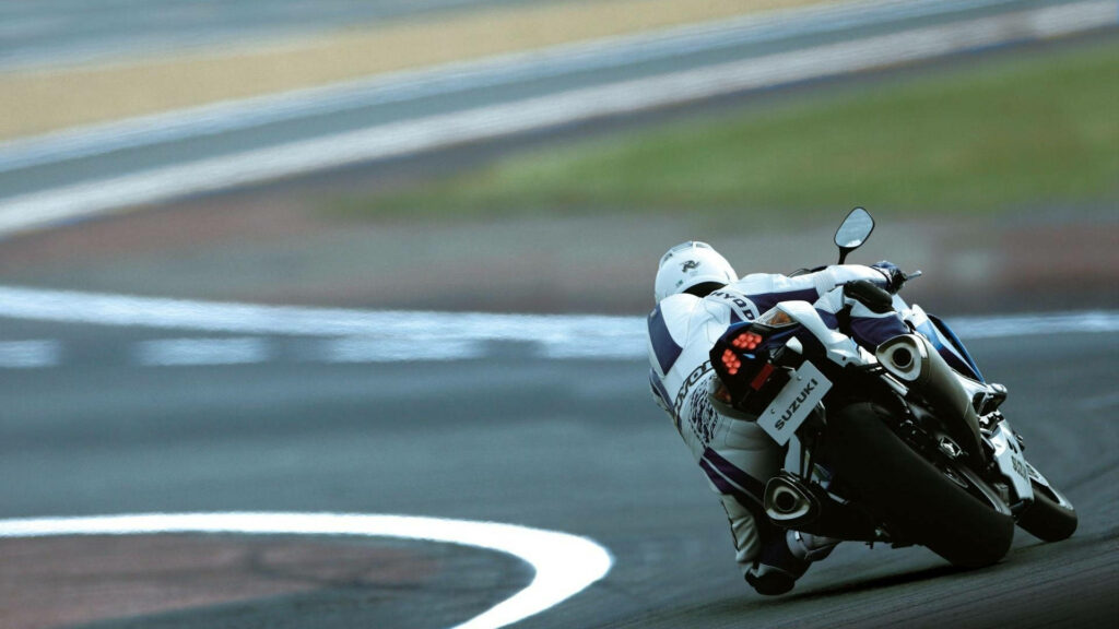 Thrilling Motorcycle Race Track Wallpaper: Speed & Precision Background