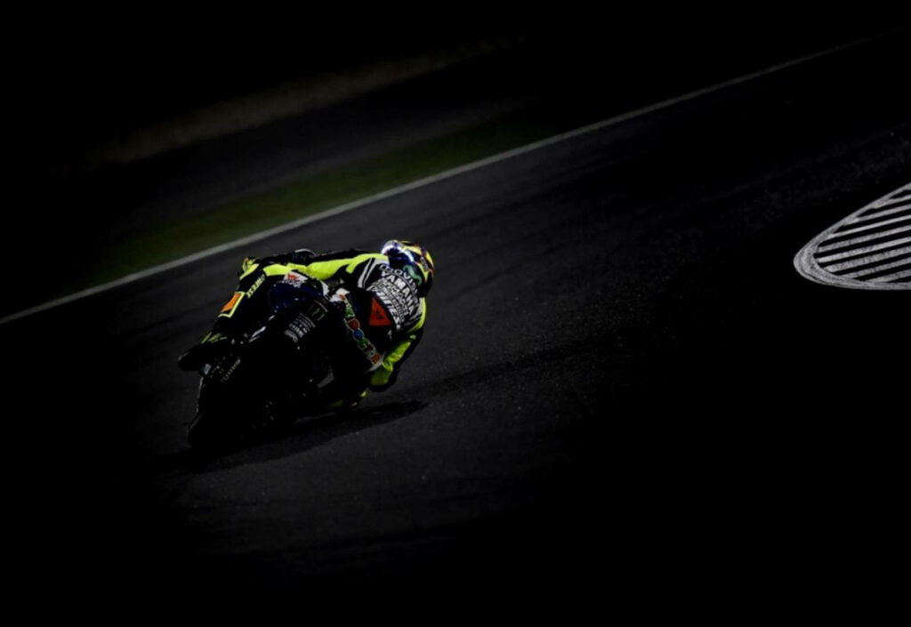 Dynamic Motorcycle Racing Wallpaper: Neon Rider Action on Track