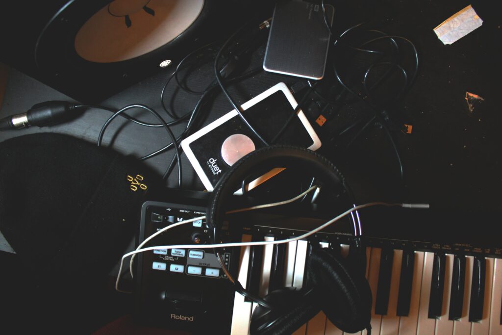 Dynamic Music Production Setup Wallpaper with Synthesizer & Headphones
