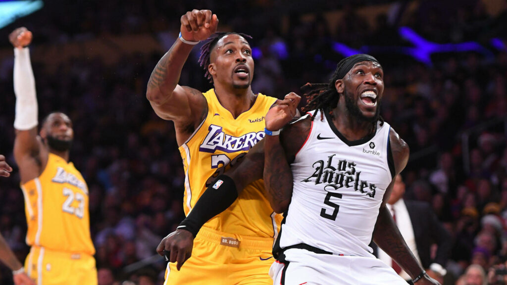 Dwight Howard Lakers and Montrezl Harrell Clippers battle in NBA game with LeBron James background Wallpaper