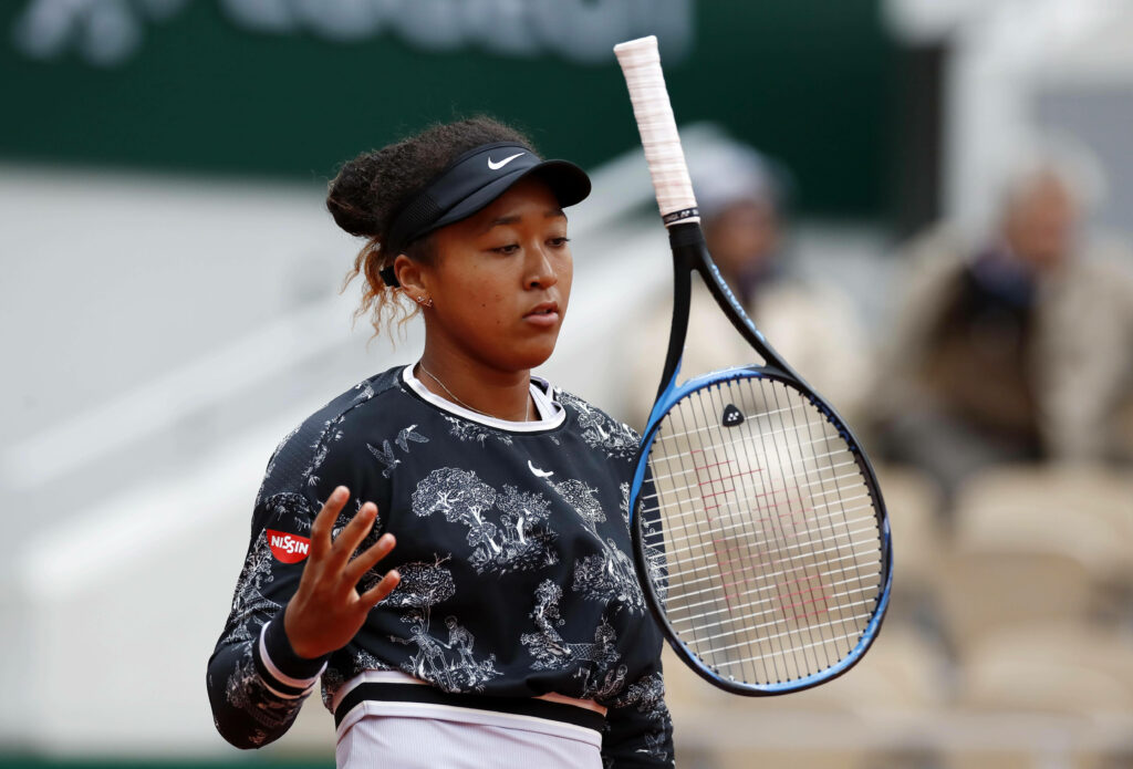 Dynamic Naomi Osaka Tennis Wallpaper: Action-Packed Mid-Motion Shot