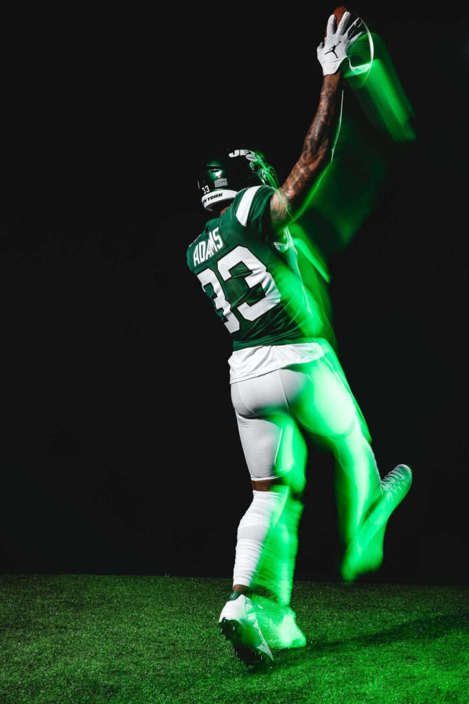 Dynamic Neon Green Motion Wallpaper: Jamal Adams Football Action