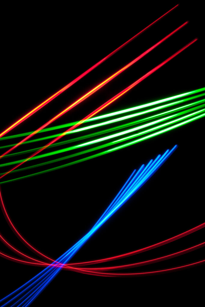 Neon Lines on Black Background: Vibrant Wallpaper for Bold Decor
