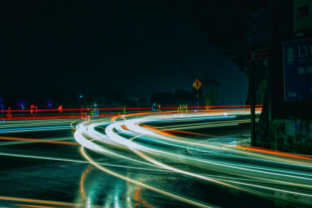 Illuminated Light Trails: Nighttime Dynamic Wallpaper Background