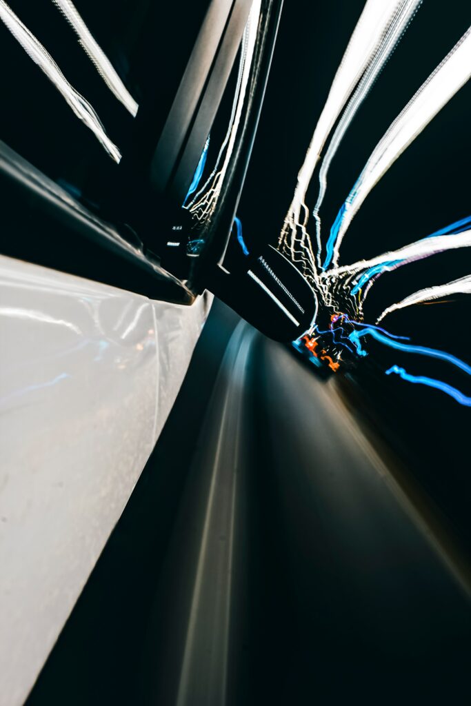 Thrilling Night Speed: Dynamic Long Exposure Wallpaper Background