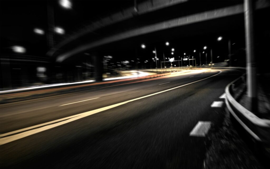 Dynamic Nighttime Road Scene Wallpaper with Motion Blur and Streetlights