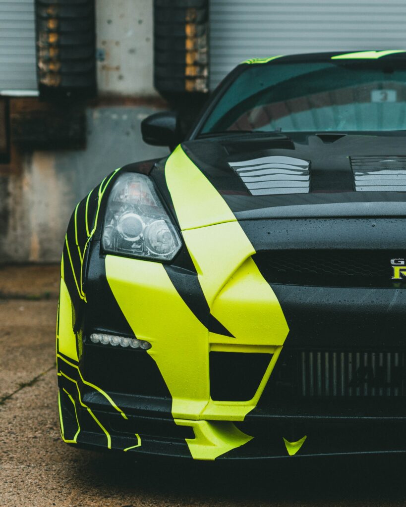 Dynamic Nissan GT-R Wallpaper: Striking Green & Black Design Close-Up