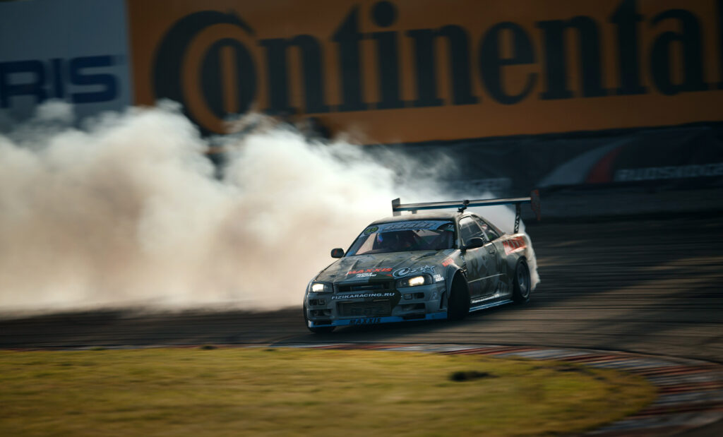Thrilling Nissan Skyline GTR R34 Drift Wallpaper - Speed & Precision