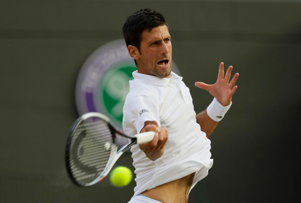 Dynamic Novak Djokovic Wallpaper: Intense Tennis Action Background