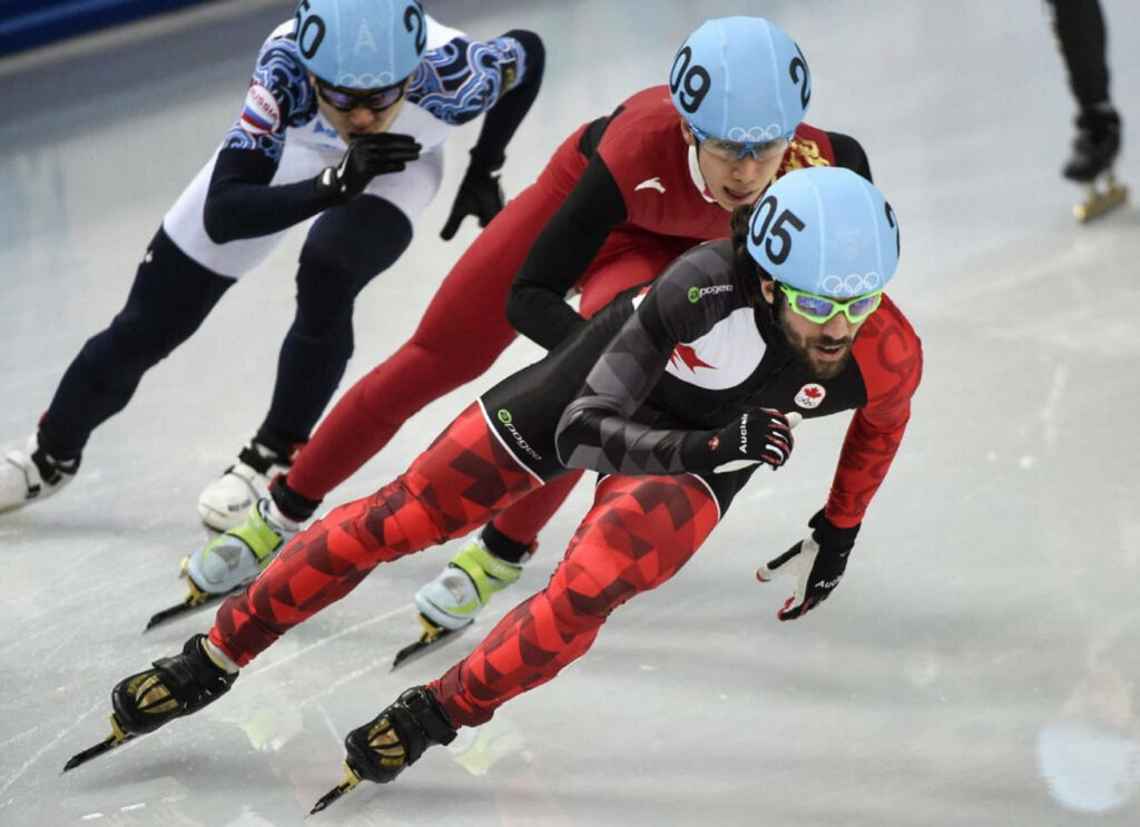 Dynamic Speed Skating Wallpaper: Intense Olympic Sports on Ice