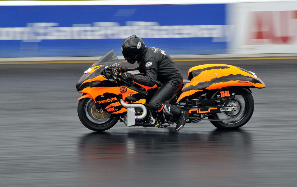Sleek Orange & Black Racing Motorcycle Wallpaper: Speed & Performance