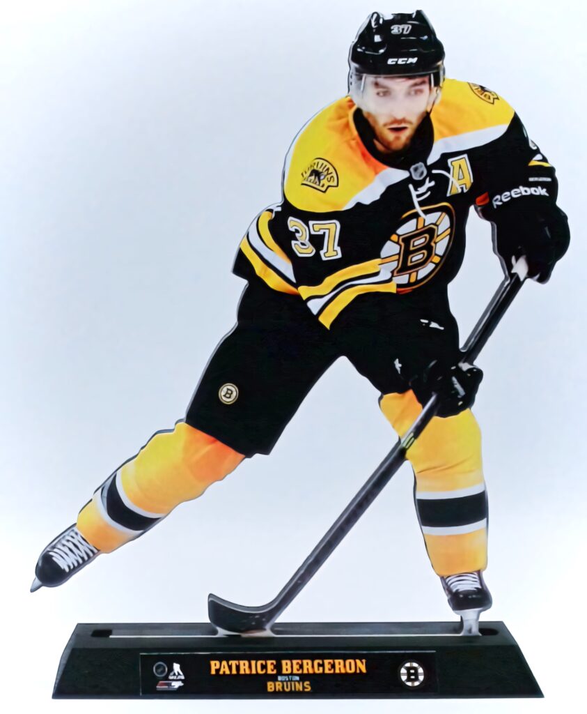 Patrice Bergeron 2D statue wallpaper in Boston Bruins black gold uniform action pose background