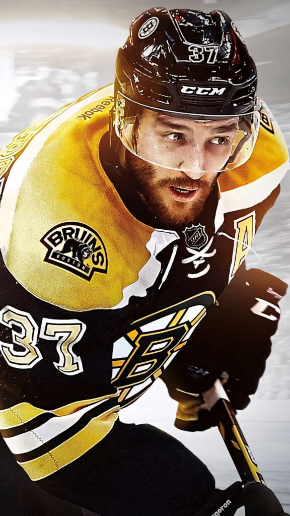 Dynamic Patrice Bergeron Boston Bruins captain in black and gold jersey action NHL wallpaper background