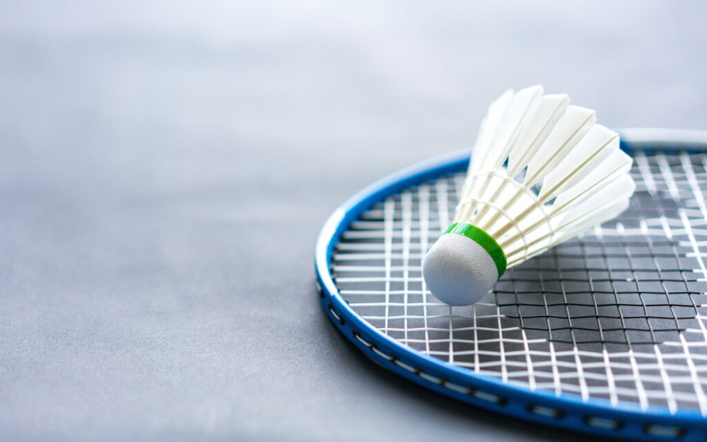 Precision Strikes: Captivating 4K Closeup of Badminton Racket in Sports Wallpaper