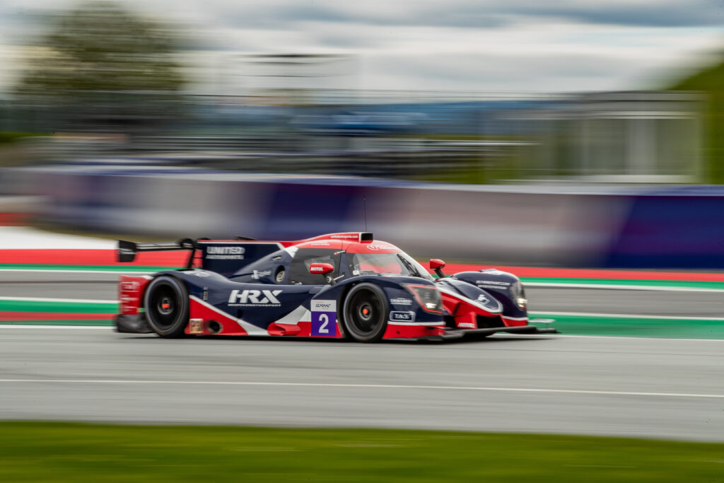 Dynamic Race Car Wallpaper: Speed and Vibrant Colors on Track