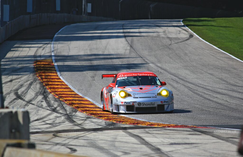 High-Res Racing Car Wallpaper: Speed on Asphalt Track