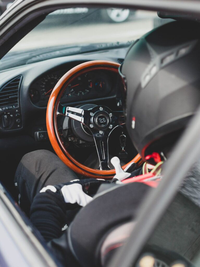 Stylish Racing Car Interior Wallpaper with Sleek Steering Wheel