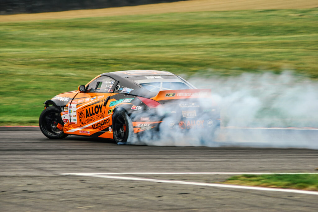 High-Speed Car Drifting Wallpaper: Vibrant Racing Action Background