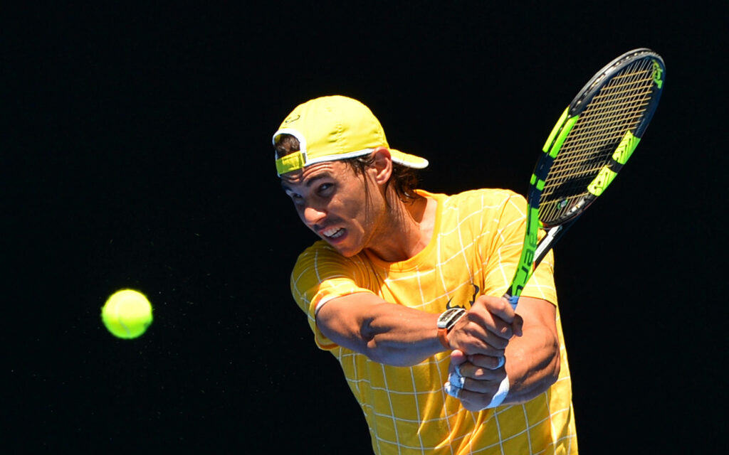 Rafael Nadal Dynamic Tennis Wallpaper: Intense Action & Power Shot